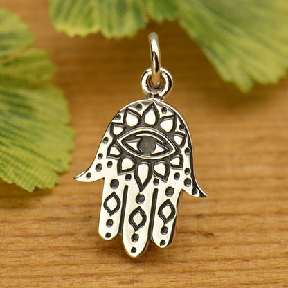 sterling silver tiny hamsa hand charm. 
