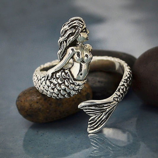 925 Sterling silver ring that is adjustable shows a mermaid witht the tail wrapping around to the front. 